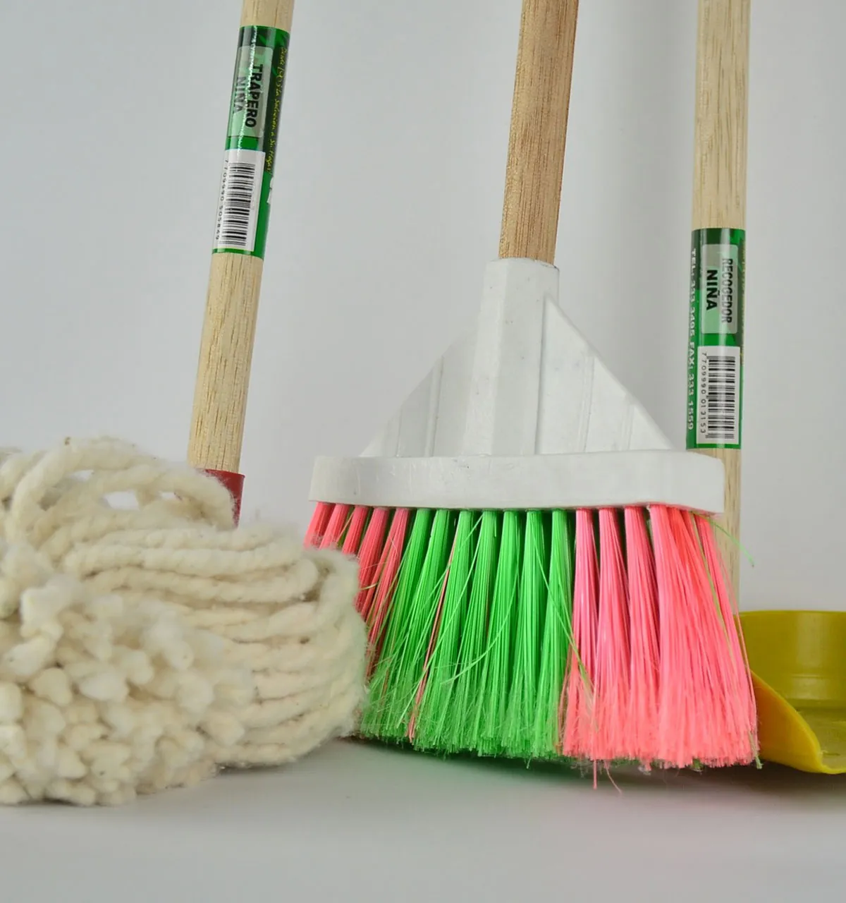 A broom, mop and dustpan